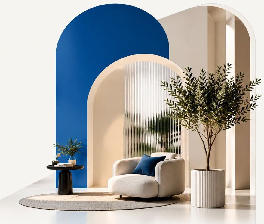 A bright, spotless room with arched walls, an armchair and an olive tree